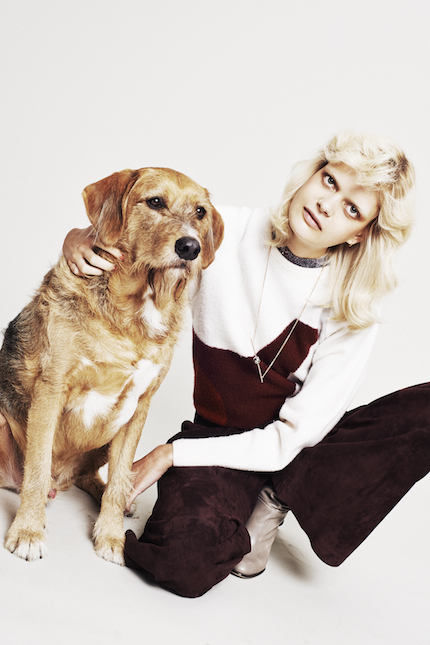 Printed shirt by Tiger of Sweden; Sweater by Lacoste; Trousers by Joseph; Boots by Malene Birger; Necklace by Bjørg