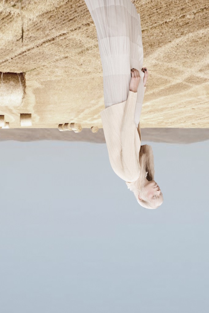 Top by Issey Miyake, skirt by Issey Miyake, necklace by Dries Van Nooten